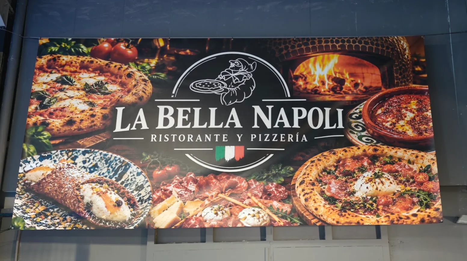Trabajo real de lona publicitaria impresa para una pizzería